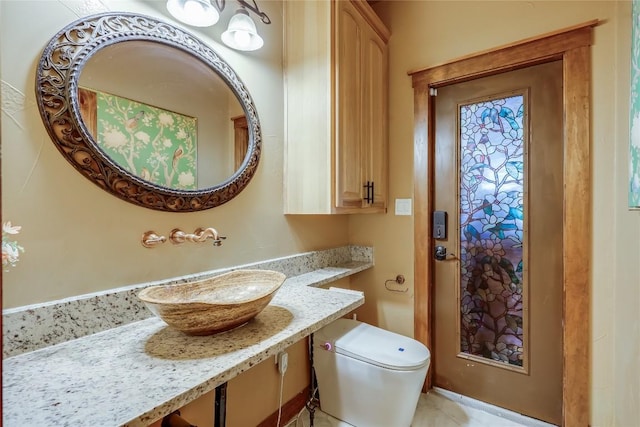 bathroom with toilet and sink