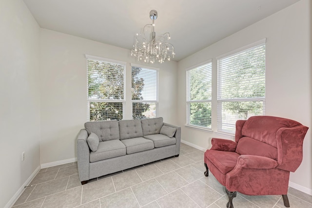 tiled living room featuring a chandelier