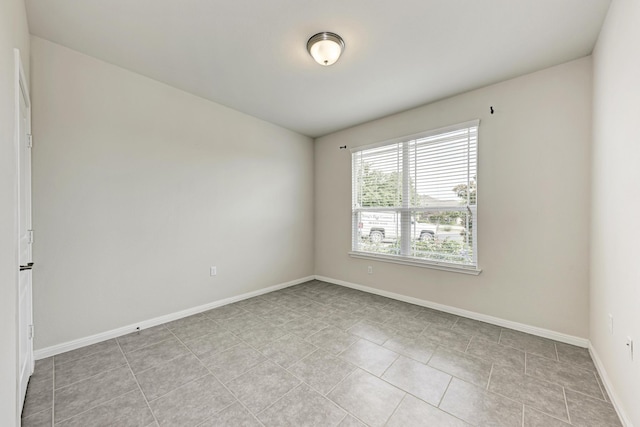 empty room featuring light tile patterned floors