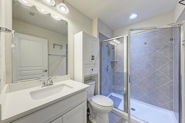 bathroom with vanity, toilet, and walk in shower