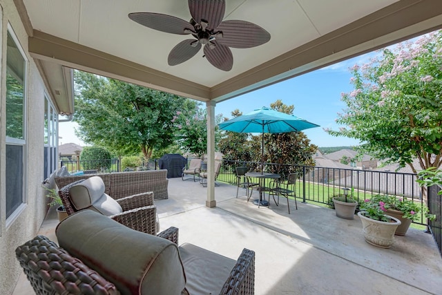 view of patio / terrace featuring ceiling fan and an outdoor living space