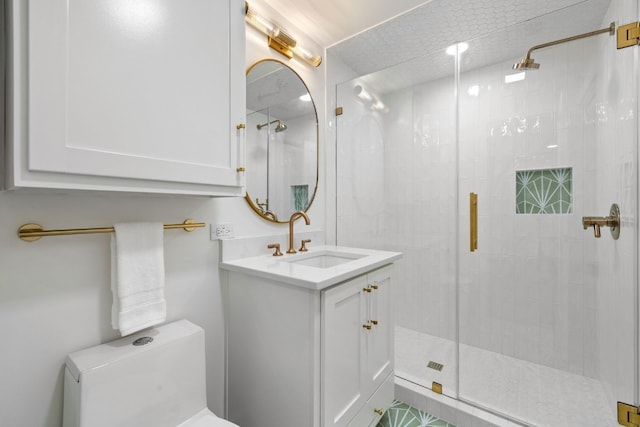 full bathroom with toilet, a stall shower, and vanity