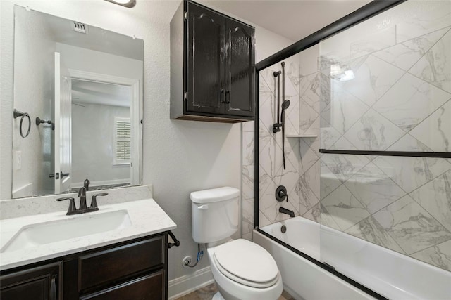 full bathroom featuring vanity, toilet, and combined bath / shower with glass door