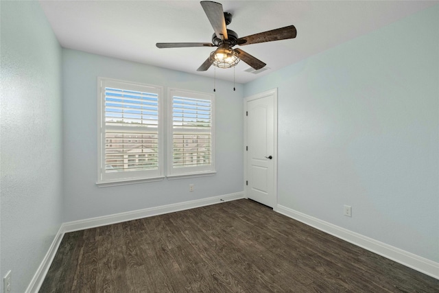 unfurnished room with dark hardwood / wood-style floors and ceiling fan