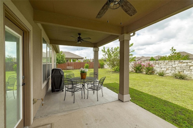 view of patio featuring ceiling fan