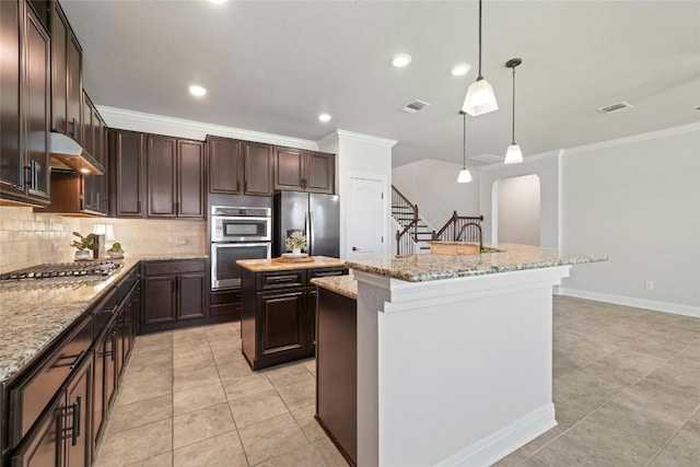 kitchen featuring light tile patterned flooring, decorative backsplash, light stone countertops, a kitchen island, and appliances with stainless steel finishes