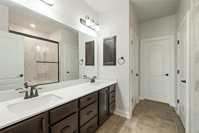 bathroom featuring tile patterned floors and dual bowl vanity