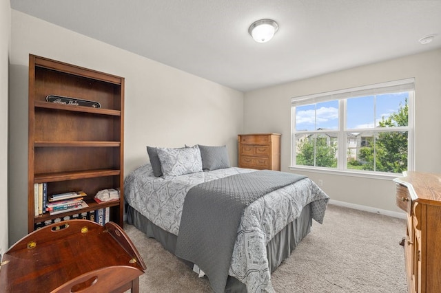 bedroom featuring light colored carpet