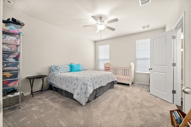 carpeted bedroom featuring ceiling fan