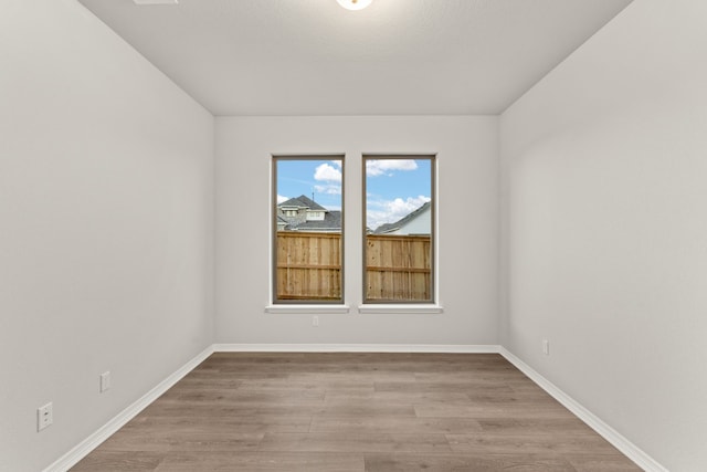 spare room with light hardwood / wood-style floors