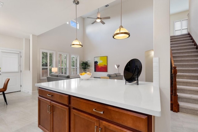 15008 Via Del Corso Dr, Bee Cave, TX 78738 - kitchen with open floor plan, high vaulted ceiling, a ceiling fan, pendant lighting, and light countertops