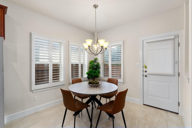 dining space with a notable chandelier