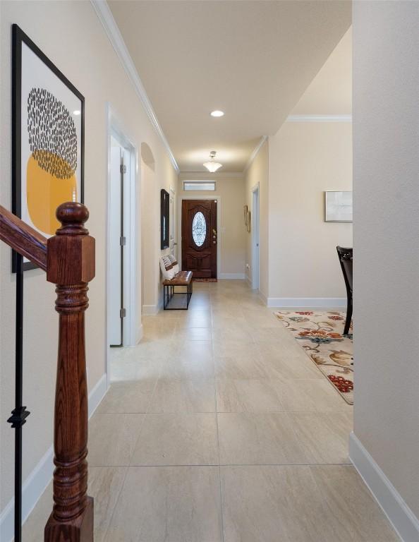 15008 Via Del Corso Dr, Bee Cave, TX 78738 - hallway with crown molding, light tile patterned floors, and baseboards