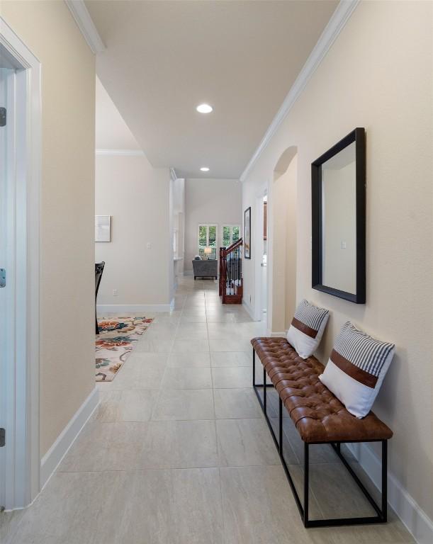 15008 Via Del Corso Dr, Bee Cave, TX 78738 - hall with ornamental molding, baseboards, recessed lighting, light tile patterned floors, and arched walkways