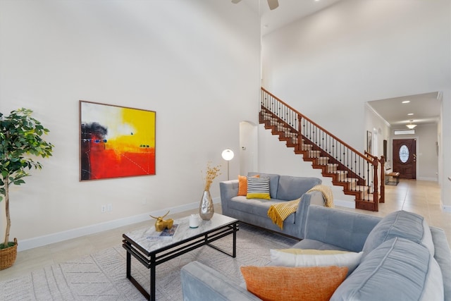 tiled living room with a high ceiling