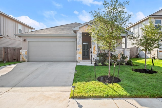 view of front facade with a garage and a front yard