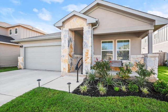 view of front of home with a garage and a porch