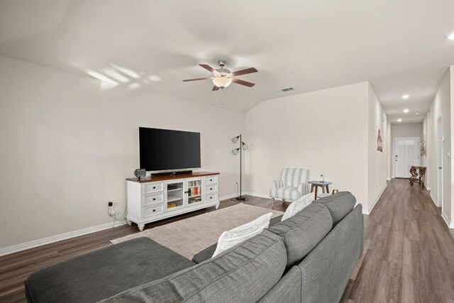 living room with lofted ceiling, wood-type flooring, and ceiling fan