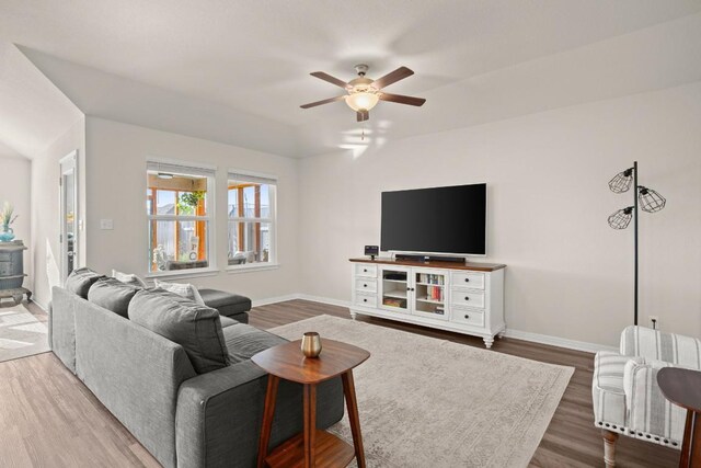 living room with hardwood / wood-style flooring and ceiling fan