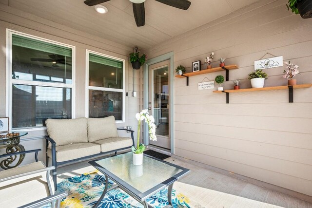 exterior space featuring an outdoor living space and ceiling fan