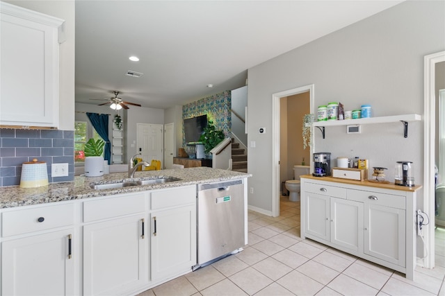 kitchen with white cabinets, sink, kitchen peninsula, dishwasher, and ceiling fan