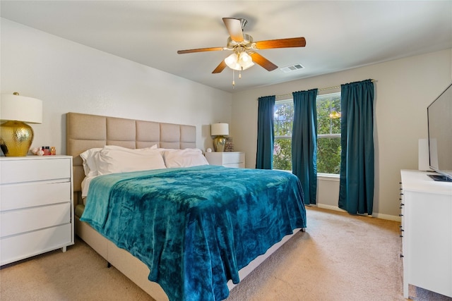 bedroom featuring ceiling fan and light colored carpet