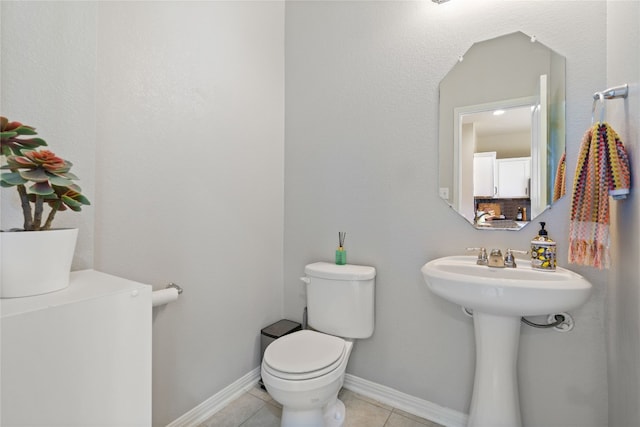 bathroom featuring tile patterned floors and toilet