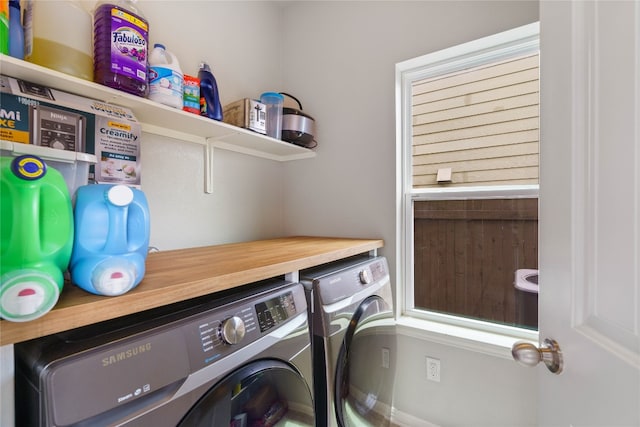 washroom featuring washer and dryer