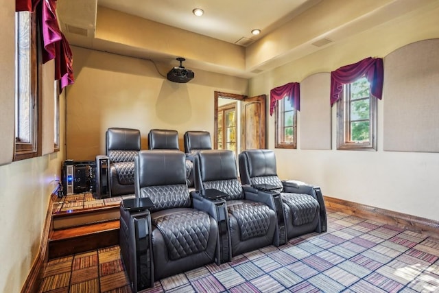 cinema room featuring baseboards and visible vents