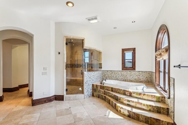 226 Canyon Turn Trl, Austin, TX 78734 - bathroom featuring a garden tub, tile patterned flooring, a shower stall, recessed lighting, and baseboards