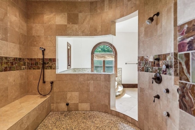 bathroom with tiled shower