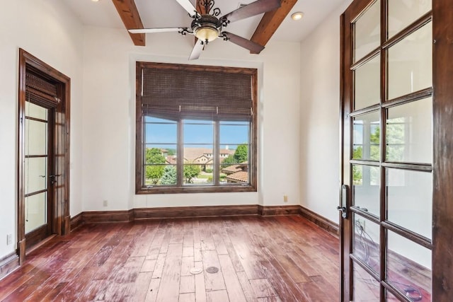 226 Canyon Turn Trl, Austin, TX 78734 - unfurnished room featuring hardwood / wood-style flooring, baseboards, beam ceiling, french doors, and a ceiling fan
