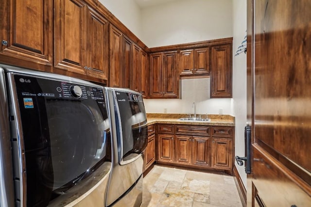 226 Canyon Turn Trl, Austin, TX 78734 - laundry area with cabinet space, light stone finish floors, and washer and clothes dryer