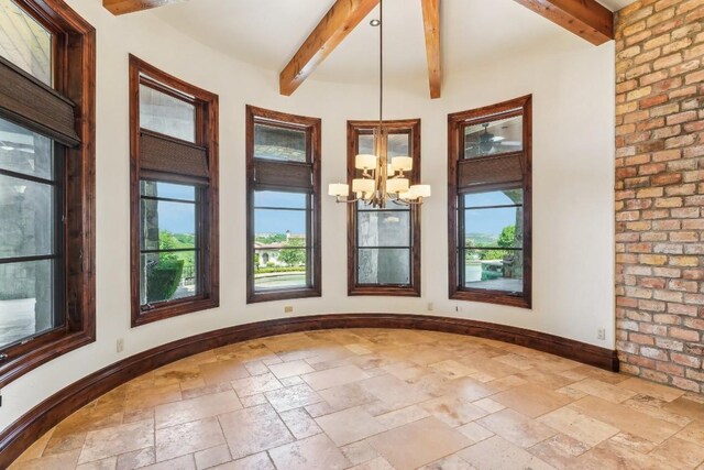 226 Canyon Turn Trl, Austin, TX 78734 - unfurnished dining area with healthy amount of natural light, stone tile flooring, a chandelier, and beamed ceiling