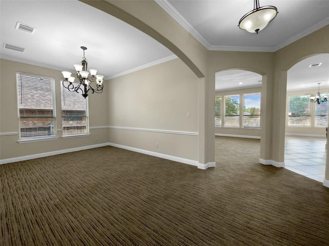 carpeted empty room with ornamental molding and a notable chandelier