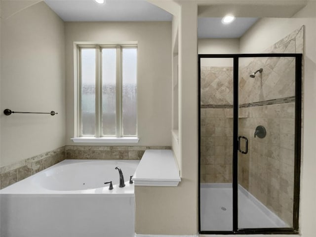 bathroom featuring plus walk in shower