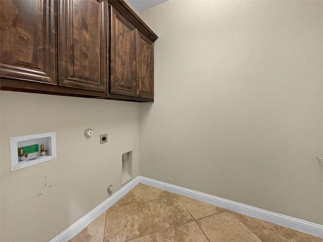 clothes washing area featuring cabinets, washer hookup, hookup for an electric dryer, and hookup for a gas dryer