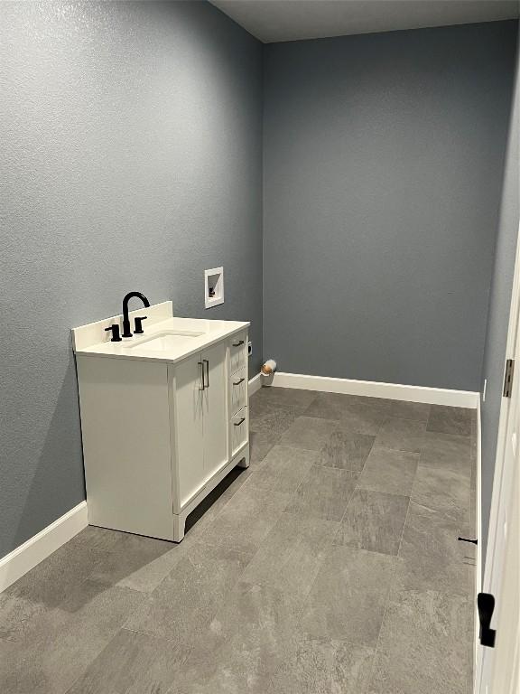 interior space with vanity and tile patterned flooring