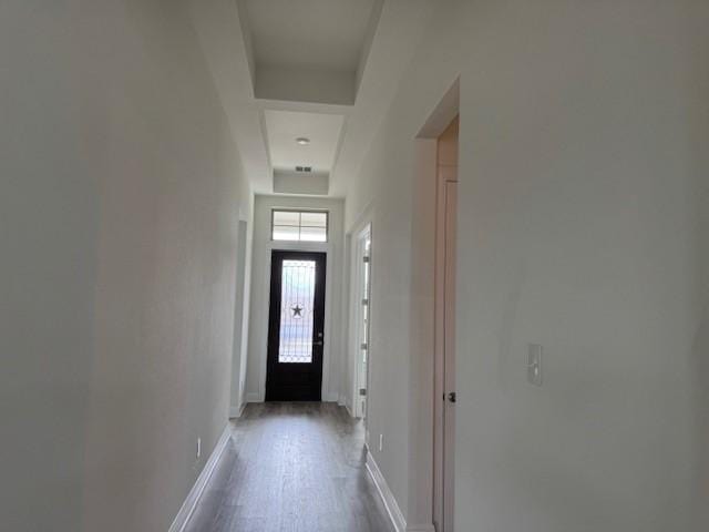 doorway with hardwood / wood-style flooring