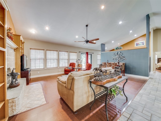 living room with ceiling fan, a healthy amount of sunlight, and high vaulted ceiling