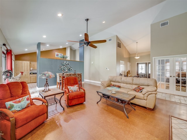 living room with high vaulted ceiling, ceiling fan, and french doors