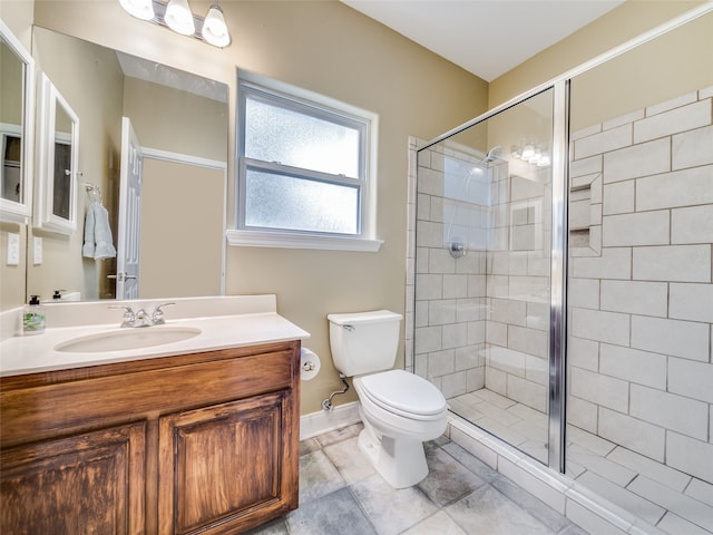 bathroom with toilet, an enclosed shower, vanity, and tile patterned floors