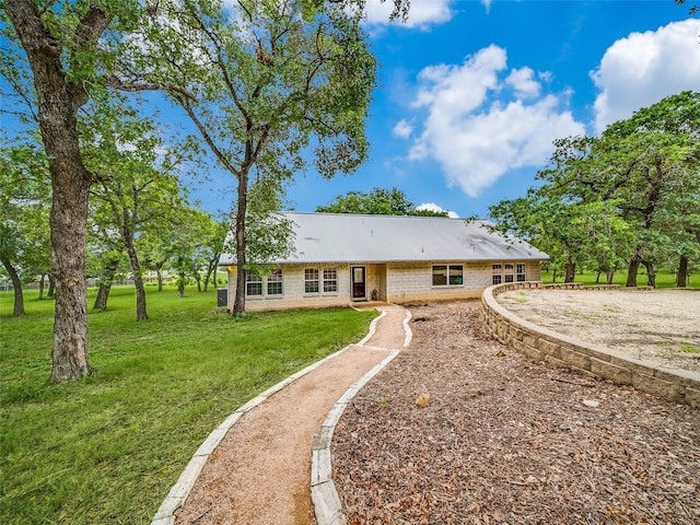 back of house with a lawn