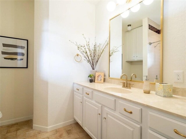 bathroom with vanity and tile patterned floors