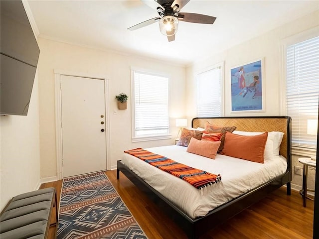 bedroom featuring dark hardwood / wood-style flooring and ceiling fan