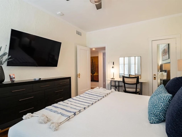 bedroom with ceiling fan and ornamental molding