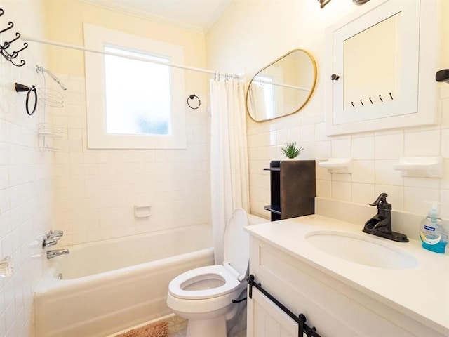 full bathroom featuring vanity, toilet, shower / bath combo with shower curtain, and tile walls