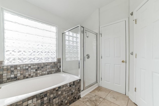 bathroom with separate shower and tub