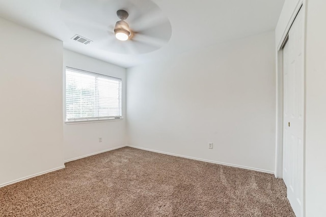 unfurnished bedroom with a closet, ceiling fan, and carpet