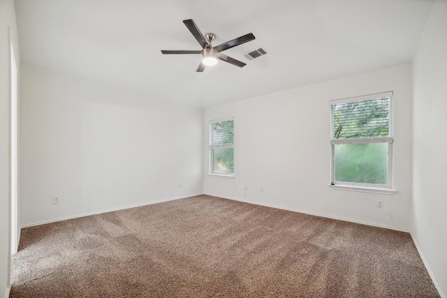 carpeted empty room with ceiling fan